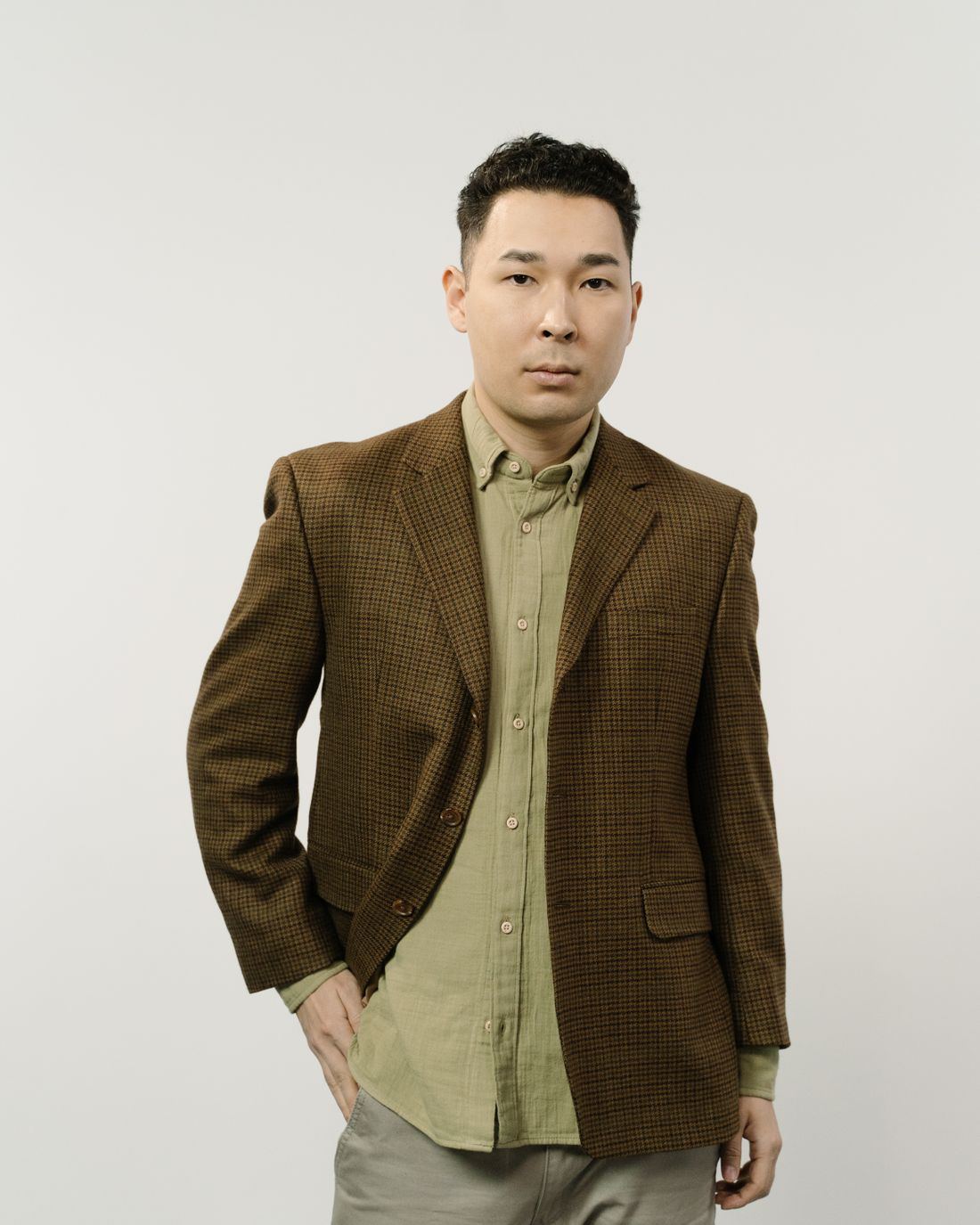 The same jacket in the walnut fleck colourway, laid flat to show the patch pockets