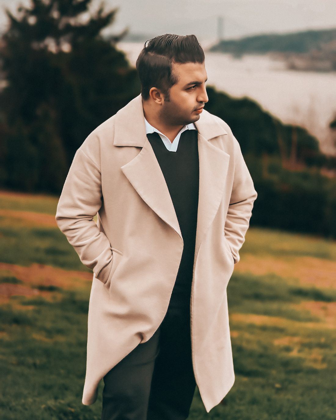 Undyed pattu overcoat seen from the back, showing the centre vent
